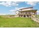 Expansive two-story home with large deck and exterior access to lower level overlooking a sprawling yard at 4339 W Briarwood Rd, Monrovia, IN 46157