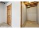 Unfinished storage space with exposed ceiling and concrete floor with an unfinished additional room off to the right at 4339 W Briarwood Rd, Monrovia, IN 46157