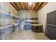 Unfinished storage room featuring built-in shelving and concrete walls and flooring at 4339 W Briarwood Rd, Monrovia, IN 46157