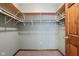 Spacious walk-in closet featuring ample shelving and storage space with painted light-green walls and neutral carpet at 4339 W Briarwood Rd, Monrovia, IN 46157