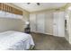 Bedroom featuring neutral walls, carpet flooring, and two closets at 438 Park Dr, Greenwood, IN 46143
