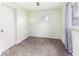 Bedroom featuring light green walls, carpet flooring, and two windows at 438 Park Dr, Greenwood, IN 46143