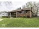 Charming brick house showcasing a well-kept lawn and traditional architecture at 438 Park Dr, Greenwood, IN 46143