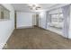 Inviting living room with large windows, plush carpet, and neutral wall color at 438 Park Dr, Greenwood, IN 46143