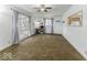 Bright living room with carpet flooring, a ceiling fan, and ample natural light at 438 Park Dr, Greenwood, IN 46143
