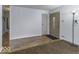 Open living room featuring wood-look floors and a neutral color scheme at 438 Park Dr, Greenwood, IN 46143