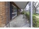 Covered porch featuring brick columns and a concrete floor at 438 Park Dr, Greenwood, IN 46143
