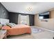 Cozy bedroom with a warm color palette, modern TV, and stylish decorative rug at 4613 Walker St, Greenwood, IN 46143