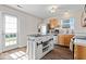 Bright kitchen with a functional center island and a view of the backyard through the door at 4613 Walker St, Greenwood, IN 46143