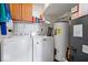 Efficient laundry room equipped with washer, dryer, and storage shelves at 4613 Walker St, Greenwood, IN 46143