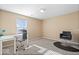 Bright office with a modern desk, comfy chair, and ample natural light at 4613 Walker St, Greenwood, IN 46143
