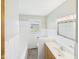 A bathroom features white tiling and light wood colored vanity at 4715 Southern Ave, Anderson, IN 46013