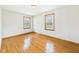 An additional bedroom features hardwood flooring and two windows at 4715 Southern Ave, Anderson, IN 46013