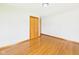 This bedroom features hardwood flooring and a closet for storage at 4715 Southern Ave, Anderson, IN 46013