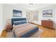 Comfortable bedroom featuring hardwood floors, ample natural light, and calming decor at 4715 Southern Ave, Anderson, IN 46013