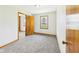 Bright bedroom features a window with natural light and neutral carpet at 4715 Southern Ave, Anderson, IN 46013