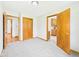 This is an additional bedroom with hardwood doors and neutral carpet at 4715 Southern Ave, Anderson, IN 46013