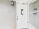 A close-up of a white front door with a glass window and a light fixture at 4715 Southern Ave, Anderson, IN 46013
