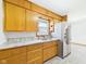 Well-equipped kitchen with a stainless steel refrigerator, sleek countertops, and ample cabinet space at 4715 Southern Ave, Anderson, IN 46013