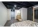 Finished basement bedroom with dresser and barn door at 4719 Evanston Ave, Indianapolis, IN 46205