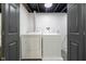 Finished basement laundry room with dark trim at 4719 Evanston Ave, Indianapolis, IN 46205