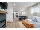 Open-concept living space flows seamlessly into the kitchen, perfect for modern living and entertaining at 4719 Evanston Ave, Indianapolis, IN 46205
