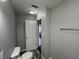 Modern bathroom with tile floors and an open doorway to another room in the house at 4823 Atwell Dr, Lawrence, IN 46226