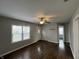 Spacious living room with wood-look floors, a ceiling fan, and a view of other rooms in the home at 4823 Atwell Dr, Lawrence, IN 46226