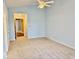 Carpeted bedroom with natural light, ceiling fan, and doorways at 5129 W Preakness Ct, Muncie, IN 47304
