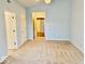 Bright bedroom with carpet, ceiling fan, and multiple doors at 5129 W Preakness Ct, Muncie, IN 47304