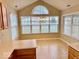 Bright dining area with light wood cabinets, an island, and many windows offering ample natural light at 5129 W Preakness Ct, Muncie, IN 47304