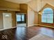 Open dining room with modern chandelier and large arched window at 5129 W Preakness Ct, Muncie, IN 47304