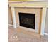 Tiled fireplace with white mantle and columns makes for a warm and cozy focal point in the home at 5129 W Preakness Ct, Muncie, IN 47304