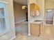 Bright kitchen featuring a range, microwave, oak cabinetry and view of living room and dinning area at 5129 W Preakness Ct, Muncie, IN 47304