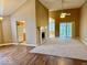 Spacious living room with fireplace, fan, and sliding door to the outside at 5129 W Preakness Ct, Muncie, IN 47304