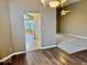 Open floorplan showing living room, dining room, and kitchen at 5129 W Preakness Ct, Muncie, IN 47304