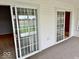 Enclosed patio with sliding glass doors and views of the yard offers indoor-outdoor living at 5129 W Preakness Ct, Muncie, IN 47304