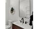 Modern bathroom with sleek fixtures, decorative mirror, and stylish sink at 514 Spruce St, Indianapolis, IN 46203