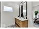 Well-appointed bathroom showcases a double vanity, modern fixtures, and decorative tile for a sophisticated design at 514 Spruce St, Indianapolis, IN 46203