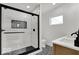 Modern bathroom features a sleek glass shower, stylish tile work, and elegant fixtures for a luxurious experience at 514 Spruce St, Indianapolis, IN 46203