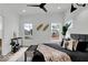Stylish bedroom featuring a plush bed, modern decor, and bright windows offering a relaxing retreat at 514 Spruce St, Indianapolis, IN 46203