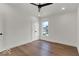Bedroom featuring wood flooring and an accent door at 514 Spruce St, Indianapolis, IN 46203