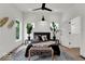 Elegant bedroom boasts a luxurious bed, stylish decor, and ample natural light for a restful ambiance at 514 Spruce St, Indianapolis, IN 46203