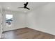 An empty bedroom with wood flooring and a modern ceiling fan at 514 Spruce St, Indianapolis, IN 46203