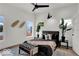 Well-lit bedroom showcases modern design, comfortable furnishings, and large windows for a serene living space at 514 Spruce St, Indianapolis, IN 46203