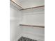 Organized closet with ample shelving and hanging space, complemented by stylish tile flooring for a functional design at 514 Spruce St, Indianapolis, IN 46203
