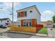 Stylish two-story home with white siding, wood accents, and a modern, angled roof at 514 Spruce St, Indianapolis, IN 46203