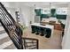 Open kitchen layout showcases modern finishes, an island with seating, and stainless steel appliances at 514 Spruce St, Indianapolis, IN 46203