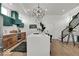 Stylish kitchen with stainless steel appliances, quartz counters, and an island with seating at 514 Spruce St, Indianapolis, IN 46203