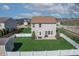 A large backyard featuring a well-manicured lawn, patio and white picket fence at 5209 Twin Bridge Blvd, Indianapolis, IN 46239